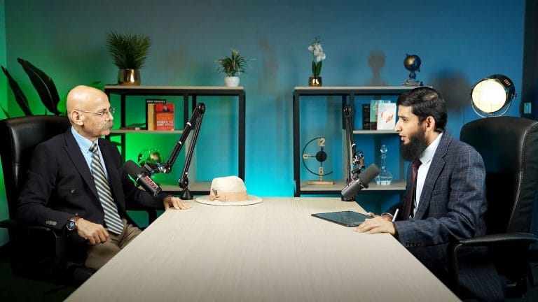 Two-guest interview recorded on a podcast studio set in Doha